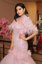 fish cut gown with feather cape