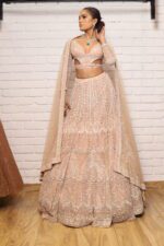 peach designer belt blouse lehenga