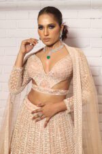 peach designer belt blouse lehenga