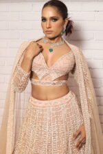 peach designer belt blouse lehenga
