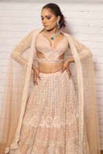 peach designer belt blouse lehenga