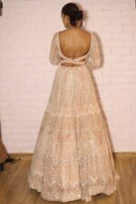 peach designer belt blouse lehenga
